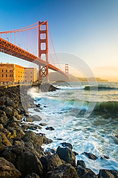 The Golden Gate Bridge, seen at sunrise from Fort Point