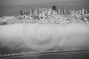 Golden Gate bridge span and cables on foggy day view from Marin