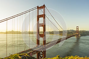 Golden Gate Bridge at sunrise and blue sky in San Francisco