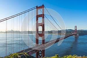 Golden Gate Bridge at sunrise and blue sky in San Francisco
