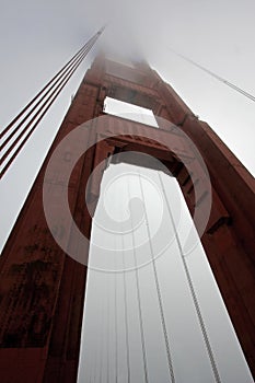 Golden Gate Bridge tower with fog rolling, San Francisco