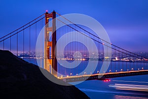 Golden gate bridge with warm light at dawn