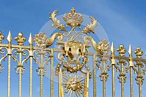 Golden gate with ornament Palace Versailles near Paris, France
