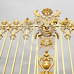 The golden gate of the Palace of Versailles, or Chateau de Versailles, or simply Versailles, in France