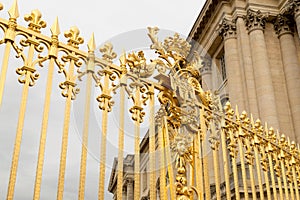 The golden gate of the Palace of Versailles, or Chateau de Versailles, or simply Versailles, in France