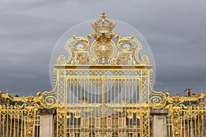 The golden gate of the Palace of Versailles, or Chateau de Versailles, or simply Versailles, in France