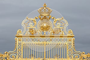 The golden gate of the Palace of Versailles, or Chateau de Versailles, or simply Versailles, in France