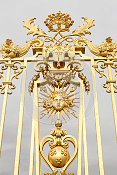 The golden gate of the Palace of Versailles, or Chateau de Versailles, or simply Versailles, in France