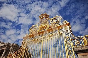 The golden gate of the palace of Versailles in Paris, France