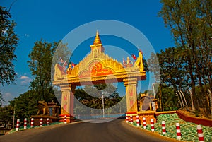 Golden gate by the road. Sagaing, Myanmar