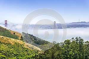 Golden Gate and the San Francisco bay covered by fog, as seen from the Marin Headlands State Park, California