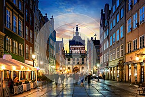 Golden Gate to the old town of Gdansk at night, Poland. Panoramic evening view, long exposure, timelapse. Historical city of