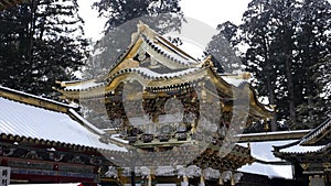 Golden gate Yomeimon in snowy Nikko during winter, Japan.