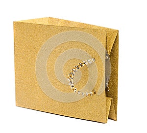 golden gift bag isolated on white