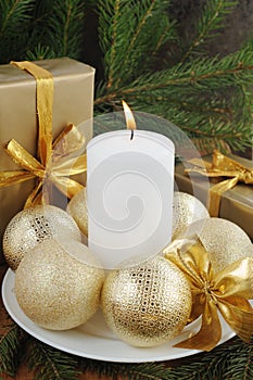 Golden gift box with christmas presents and brunch of xmas tree with golden balls