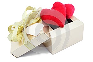 Golden gift box and red heart.
