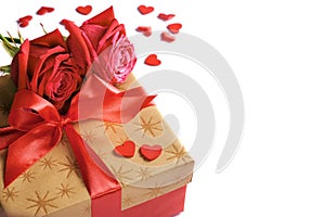 Golden gift box with red ribbon, roses and little hearts isolated on white, concept of Valentine`s day