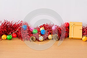 Golden gift with red ribbon on table for New Year and Christmas