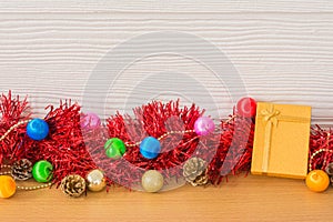 Golden gift with red ribbon on table for New Year and Christmas