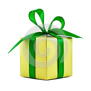 Golden gift wrapped present with green bow