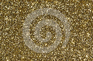 Golden glitter background with sparkles.