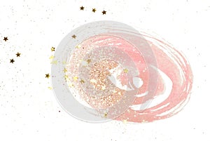 Golden glitter and glittering stars on abstract pink watercolor splash in vintage nostalgic colors on white background