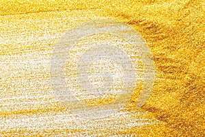 Golden glitter sand texture, abstract background.