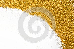 Golden glitter sand texture frame on white, abstract background.