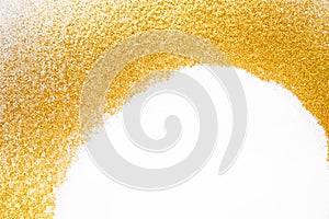 Golden glitter sand texture frame on white, abstract background.