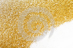 Golden glitter sand texture frame on white, abstract background.