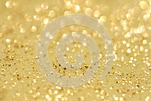 Golden glitter sparkles dust background