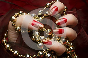 Golden glittered red nails