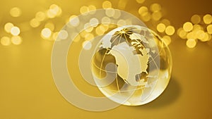 Golden globe with continents of South and North America