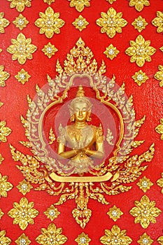 Golden god (Deva) on the red wall Thai art
