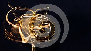 Golden Gyroscope Spinning Wildly on its Base photo