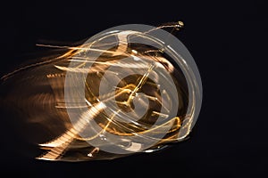 Golden Gyroscope Spinning Wildly on its Base