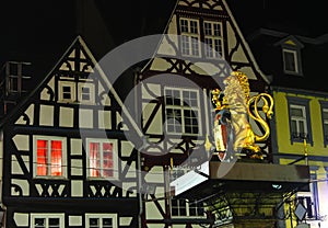 Golden Hachenburg Lion - symbol of town on Old Market square of Hachenburg, Rheinland-Pfalz, Germany at the night photo
