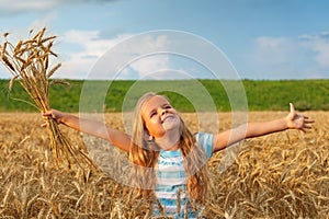 Golden hair girl in wheat field