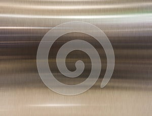 Golden hairline stainless steel. Shiny gold foil, bronze, or copper metal pattern surface texture. Close-up of interior material photo