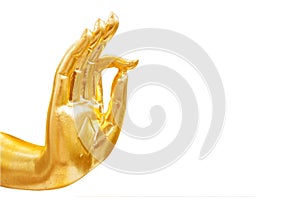 Golden hand of buddha statue isolated on white background