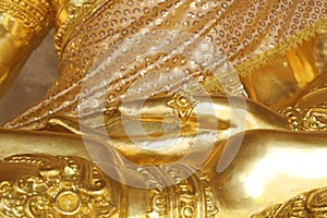 Golden hand of image Buddha close up