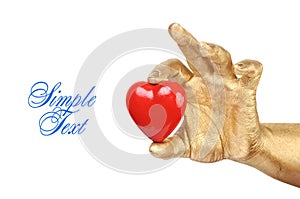 Golden hand with a red heart