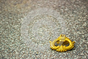 Golden handle of a stone grave, marble stone