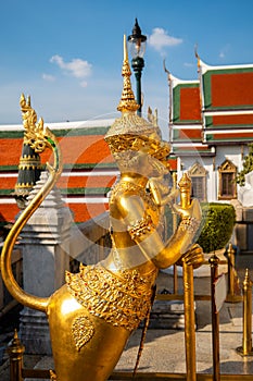 Golden hanuman god statue at Temple of Emerald Buddha in Bangkok, Thailand