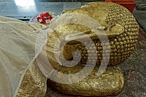 Golden Head of Reclining Buddha Statue on the side of  Parinirvana Temple in Kushinagar,