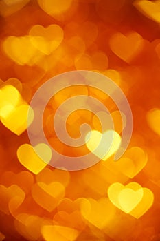 Golden heart bokeh background photo, abstract holiday backdrop