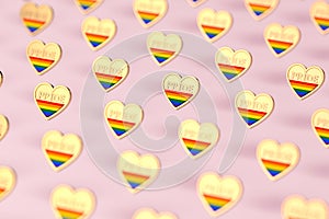 Golden heart with rainbow and word PRIDE inside. Month of pride concept.  on pastel pink background. 3D rendering