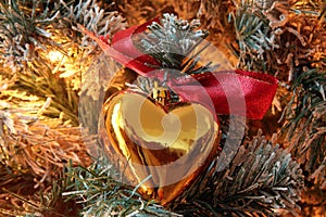 Golden hearted christmas tree ornament photo