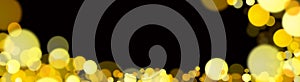 Blurred golden bokeh on a black background