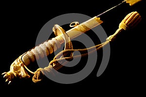 Golden hilt of ceremonial officer sword on black background